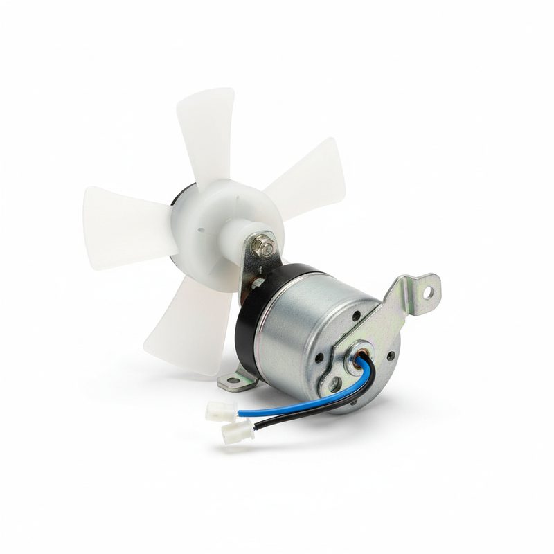 Whirlpool refrigerator evaporator fan motor with 4-blade plastic fan and wire connectors removed from appliance