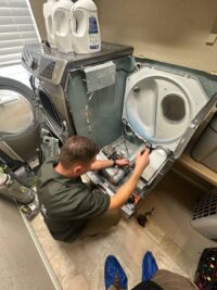 Dryer front panel removed to reach the heating assembly in Denver Metro