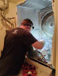 Dryer cabinet opened to reach the blower and drum assembly
