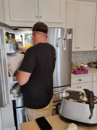 Technician diagnosing a freezer in a Denver Metro home