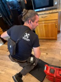 Technician completing a freezer service call in Denver Metro