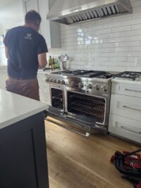 Professional style gas range serviced in a Denver Metro home