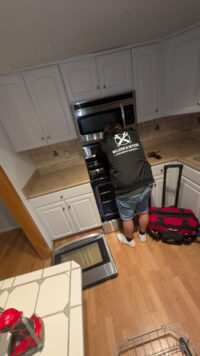Oven door removed to reach the interior of a range