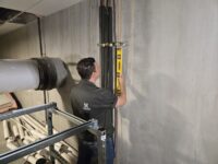 Technician working on walk-in panels and shelving