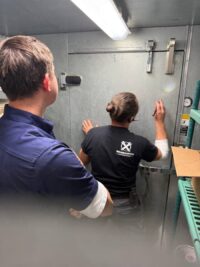 Technician going over walk-in findings with the owner