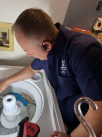 Agitator removed from a top load washer during repair in Denver Metro