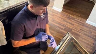 Wilson & Myers technician checking an oven